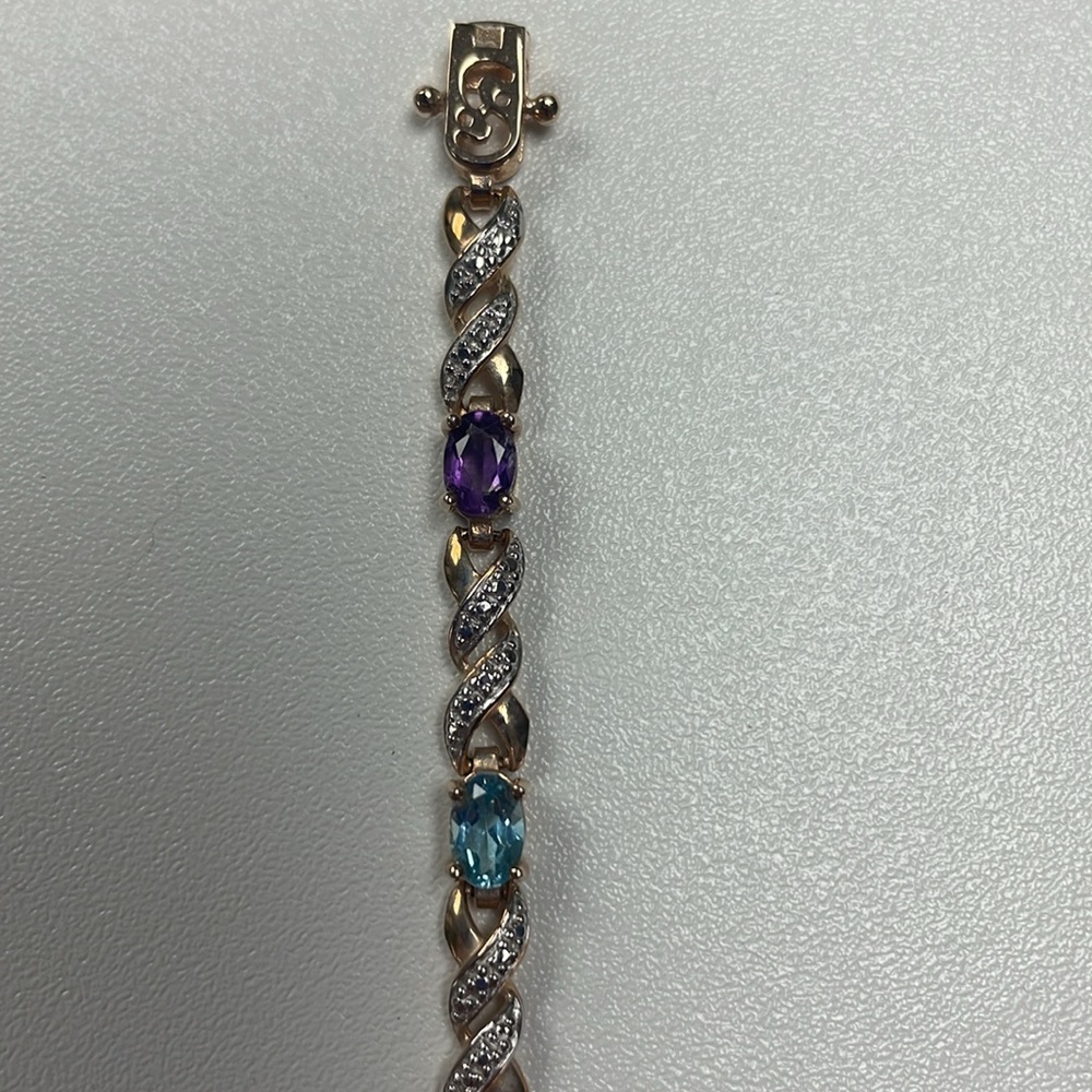 Vintage gold tone bracelet with multi colored gems. Signed with 925 R China.